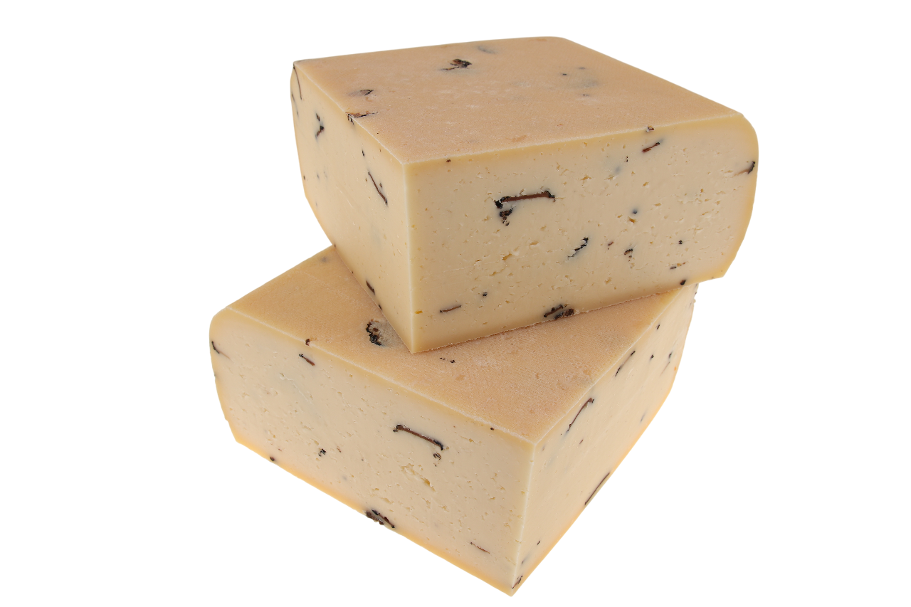 Traditionell hergestellter Raclettekäse mit schwarzem Trüffel, aus bester Schweizer Rohmilch – exklusiv online bei kaeseversand24.de